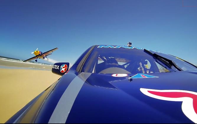 Red Bull Pits V8 Supercar Vs Stunt Plane On Aussie Beach [video]