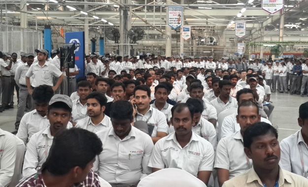 Factory workers in attendance for the roll-off ceremony