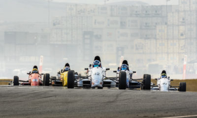 The Formula Ford field heading for turn two at Killarney Raceway.