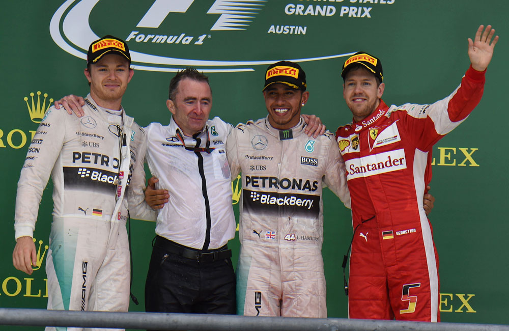 Lewis Hamilton (third from left) had his share of good fortune in a rain-affected US Grand Prix, but an error by Nico Rosberg (left) cost the German the lead late in the race. Sebastian Vettel (right) finished in a strong third for Ferrari.
